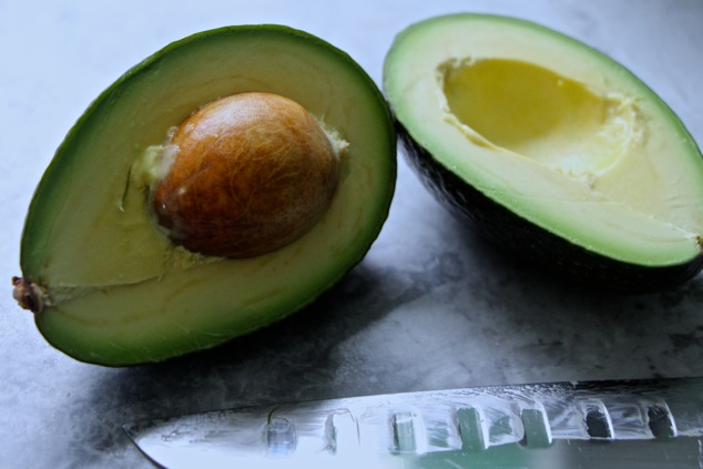 Avocado cut in half up close