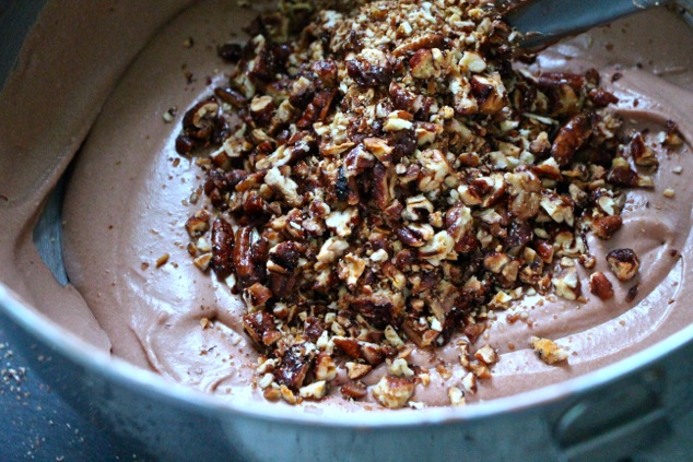 adding caramelized pecans to Nutella cream