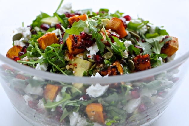 arugula sweet potato salad in a bowl