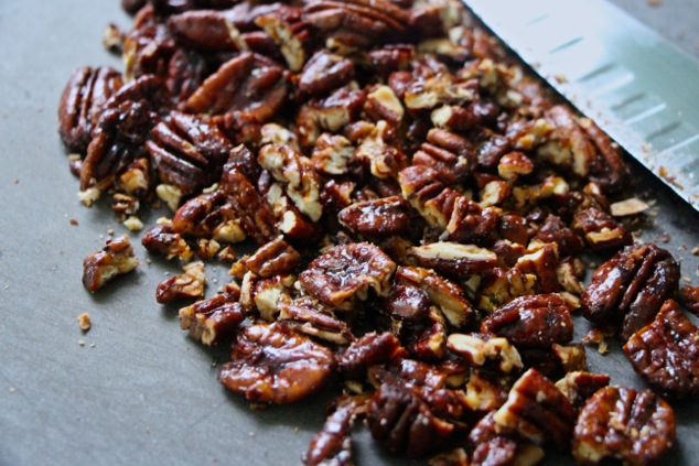 caramelized pecans on cutting board