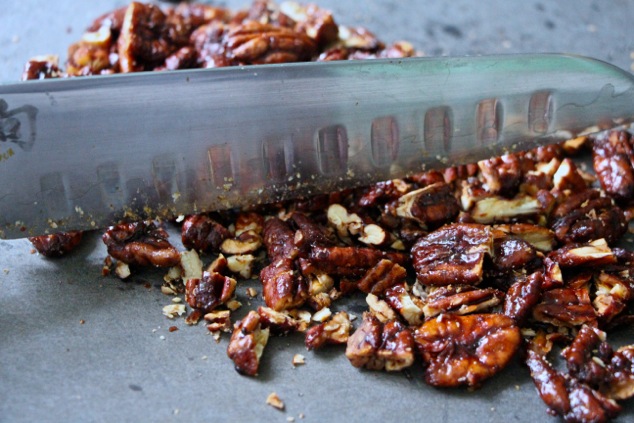 chopping caramelized pecans