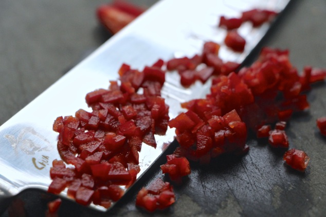 chopping red hot fresno pepper