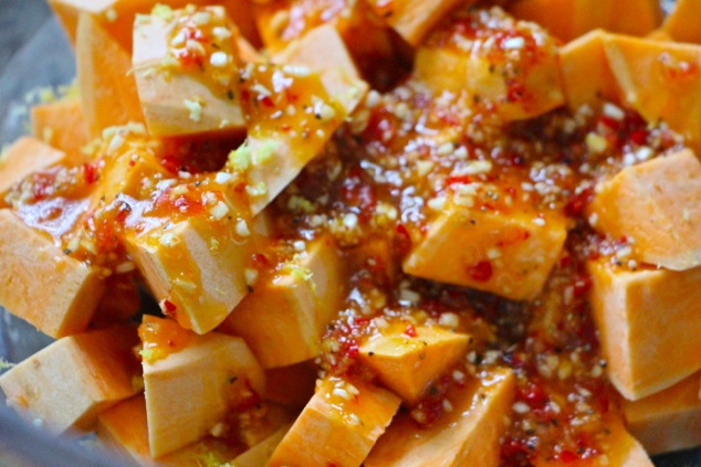 coating sweet potatoes in hot pepper mixture