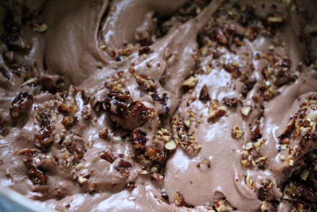 folding caramelized pecans into Nutella mousse up close