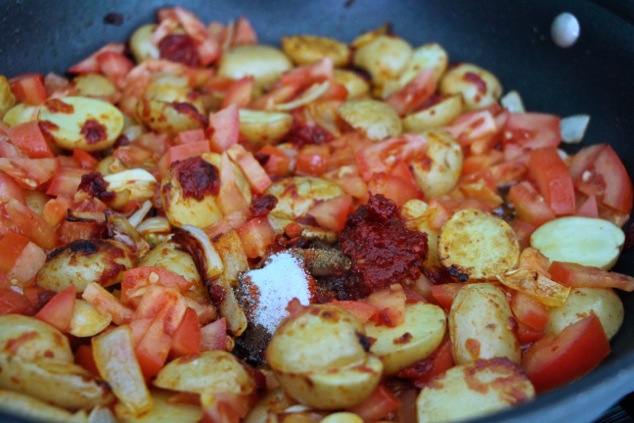 adding Harissa and spices to the pan