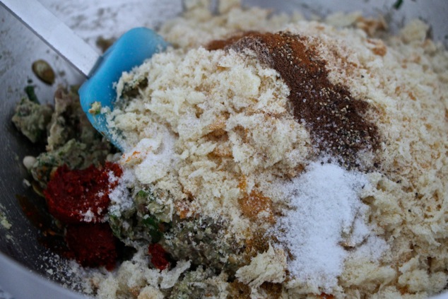 adding breadcrumbs and spices to kabob mixture