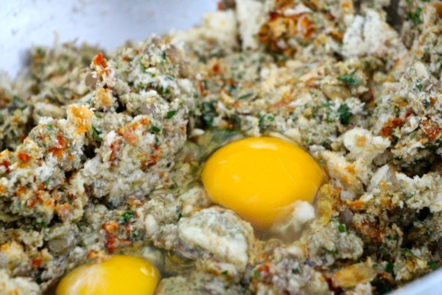 adding eggs to vegetarian kabob mixture up close