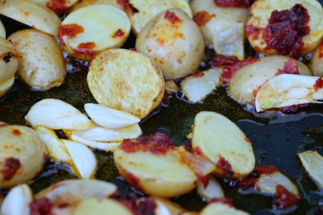 adding garlic peices to the pan