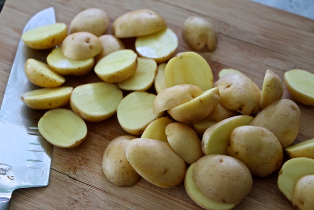 cutting baby potatoes in half