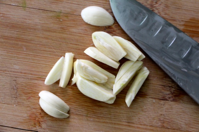 cutting garlic cloves up close