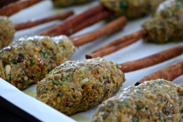 forming vegetarian kabobs on cinnamon sticks up close