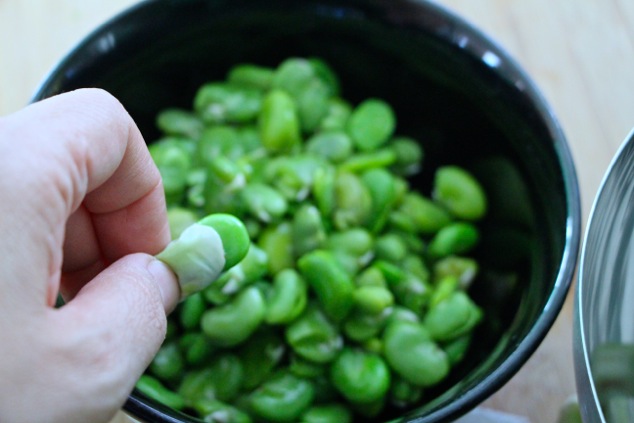 squeezing fava bean out of case