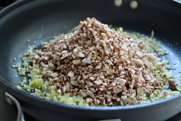 adding-chopped-mushrooms-to-the-pot