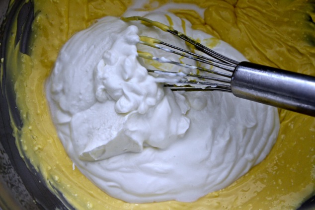 adding sour cream and yogurt to mixture