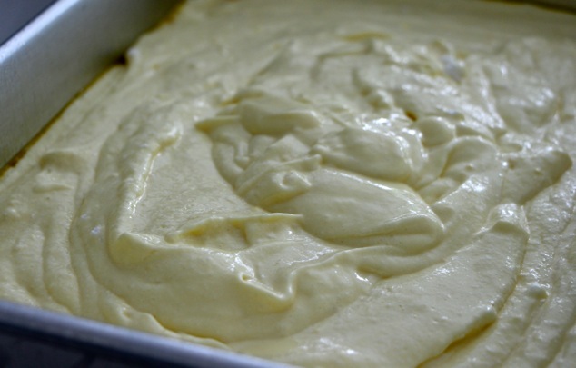 pouring batter into cake tray