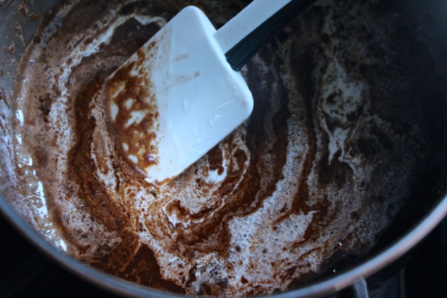 adding heavy cream to saucepan