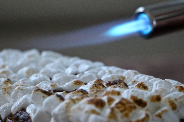 cooking torch and mini marshmallows close up