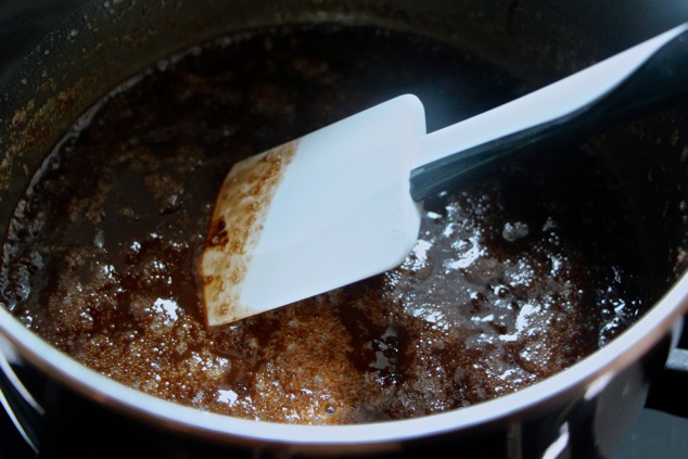 mixing cocoa powder into butter and sugar in a saucepan