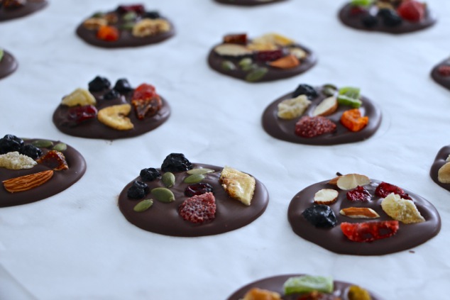 chocolate dried fruit circles on a tray setting