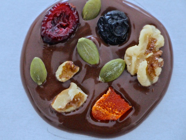 making chocolate dried fruit circle up close