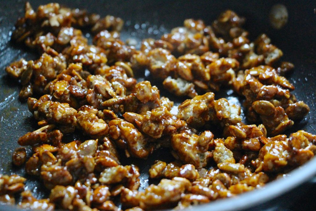 candied pumpkin seeds in pan