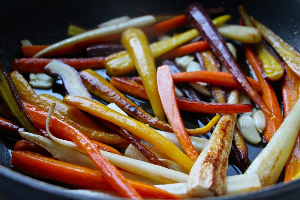 colorful carrots in pan golden color