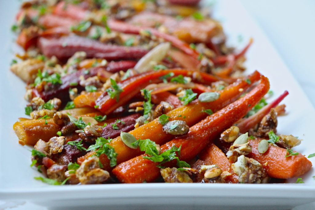 glazed carrots with fresh parsley on a serving tray